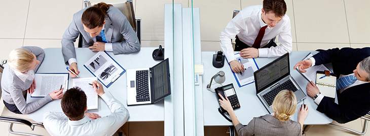 View from above of two business teams working and interacting separated by border in office