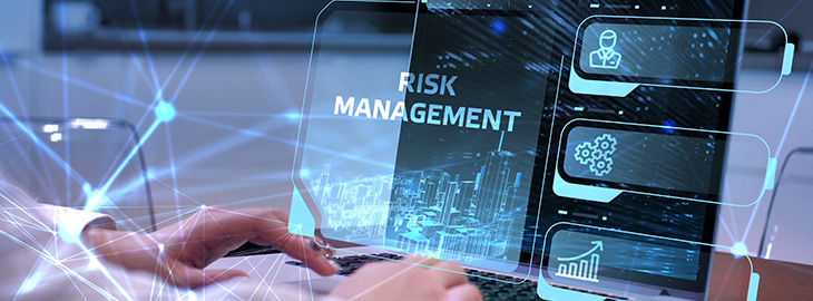 office professional creating a cybersecurity risk management plan on a laptop