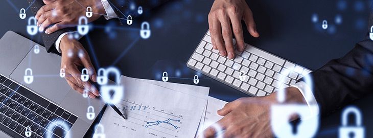 Two businesspeople man and woman working on the project to protect cyber security of international company. Padlock Hologram icons over the table with documents.