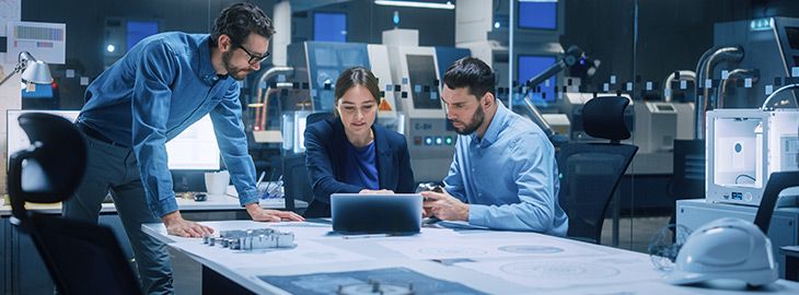 Team of engineers discussing risk management at conference table